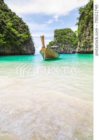 Thai traditional wooden longtail boat and beautiful beach in Thailand. 70021740