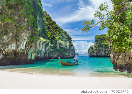 Thai traditional wooden longtail boat and beautiful beach in Thailand. Thai traditional wooden longtail boat and beautiful beach in Thailand. 70021741