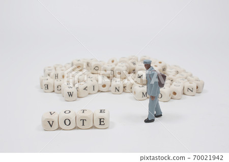 a word vote on wooden cube block with figure a word vote on wooden cube block with figure 70021942