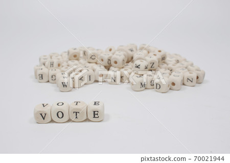a word vote on wooden cube block white background a word vote on wooden cube block white background 70021944