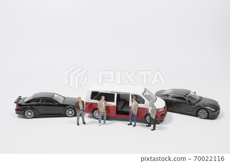 a business figure with the toy car a business figure with the toy car 70022116