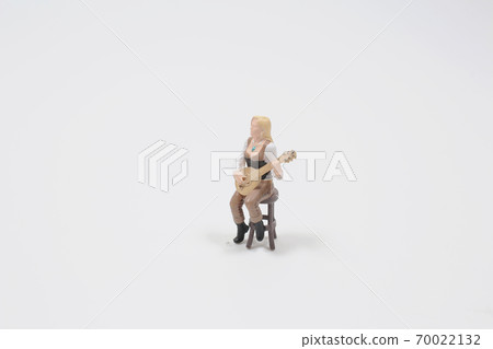 figure  woman playing acoustic guitar isolated on white 70022132