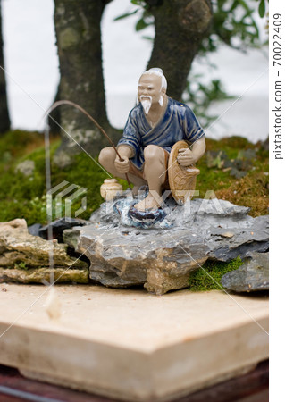 a Bonsai and Penjing landscape with miniature. 70022409