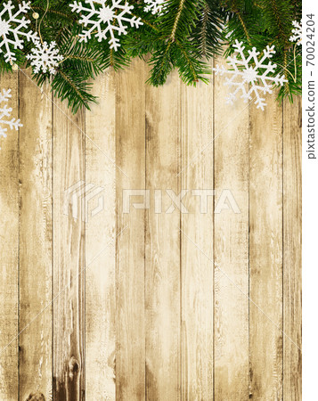Wood grain background decorated with fir tree and snow ornaments-there are multiple variations Wood grain background decorated with fir tree and snow ornaments-there are multiple variations 70024204
