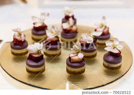 Catering, assorted snacks on plates Catering, assorted snacks on plates 70028522