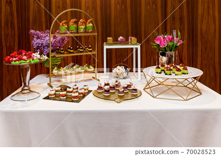 Catering, assorted snacks on plates 70028523