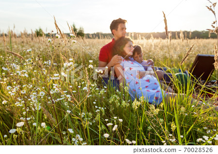 A happy family having a picnic in nature 70028526