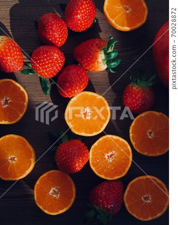 Fresh organic fruits strawberries, tangerines, pomegranates Fresh organic fruits strawberries, tangerines, pomegranates 70028872