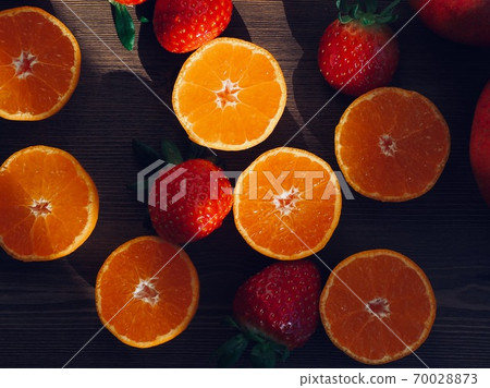 Fresh organic fruits strawberries, tangerines, pomegranates 70028873