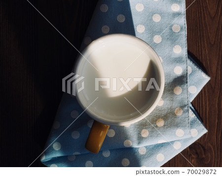 Fresh white milk in a ceramic cup 70029872