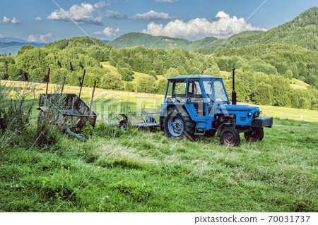 Tractor in the field, Kordiky, Kremnica hills, Slovakia 70031737