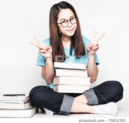 Beautiful asian female students during the exam Stay home and stressful and lazy reading books 70032565