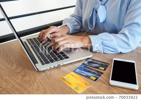 Business woman consumer spending via credit card and internet banking for shopping online Business woman consumer spending via credit card and internet banking for shopping online 70033922