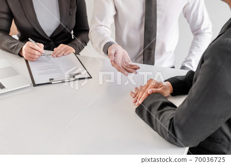 Office executives are interviewing job applicants in the meeting room Office executives are interviewing job applicants in the meeting room 70036725