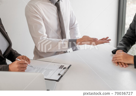 Office executives are interviewing job applicants in the meeting room Office executives are interviewing job applicants in the meeting room 70036727