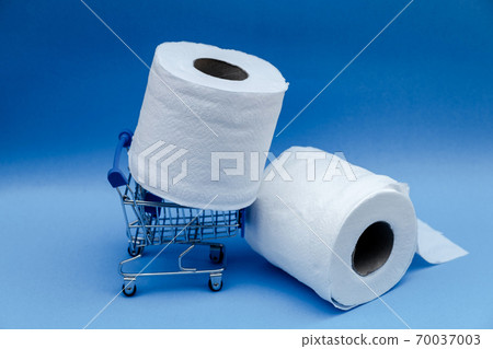 Toilet paper and shopping cart isolated on a blue background 70037003