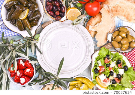 Turkish cabbage rolls and various snacks of national cuisine. Rice in grape leaves and olives. Food Turkish cabbage rolls and various snacks of national cuisine. Rice in grape leaves and olives. Food 70037634