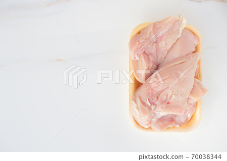 Fresh chicken meat in packaging only from the store. Chicken fillet on table with copy space Fresh chicken meat in packaging only from the store. Chicken fillet on table with copy space 70038344