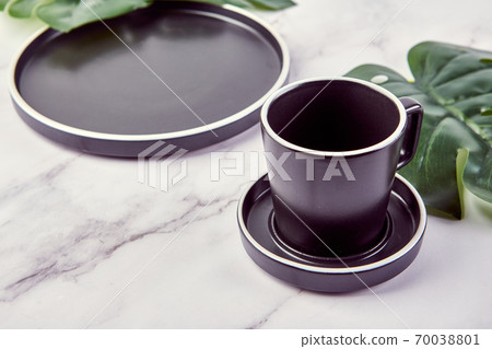 Set of modern trendy plates and coffee cup on marble background. Set of modern trendy plates and coffee cup on marble background. 70038801