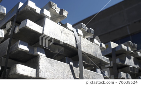 Metal ingots in Aluminium foundry for Aluminium extrusion production.. Billets for aluminium profile production at a metallurgical plant. 70039524