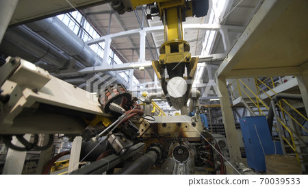 Robotic Aluminium extrusion production line factory. Production of Complex lightweight extruded aluminium metal profiles, commonly used as material in construction and manufacturing Robotic Aluminium extrusion production line factory. Production of Complex lightweight extruded aluminium metal profiles, commonly used as material in construction and manufacturing 70039533