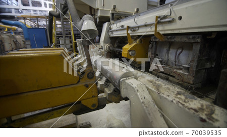 Robotic Aluminium extrusion production line factory. Production of Complex lightweight extruded aluminium metal profiles, commonly used as material in construction and manufacturing Robotic Aluminium extrusion production line factory. Production of Complex lightweight extruded aluminium metal profiles, commonly used as material in construction and manufacturing 70039535