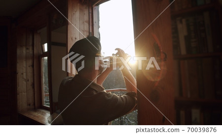 Russia, Moscow - Man at home in quarantine plays music from the windows - flash mob during pandemic of n-cov19 Coronavirus Russia, Moscow - Man at home in quarantine plays music from the windows - flash mob during pandemic of n-cov19 Coronavirus 70039876