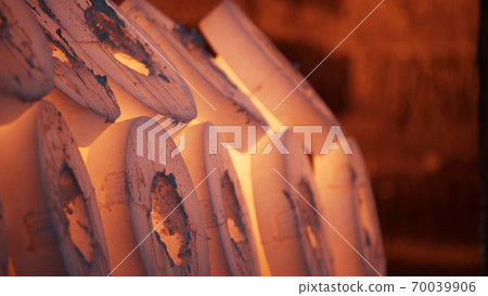 Robotic retractable furnace with red hot metal workpieces in foundry. Room for manufacture of metal products by casting. Casting shop for gassified models. Blast Furnace Steel Production Steel Works. 70039906