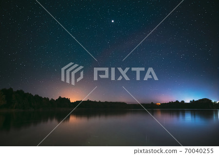 Village Novoye Lyadno, Lyepyel District, Vitebsk Province, Belarus. Real Colorful Night Stars Above Lepel Lake. Natural Starry Sky Background Backdrop Landscape 70040255