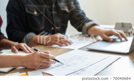 Interior designer and Architect choosing color for house coloring selection in office. 70040664