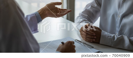 Psychiatrist consulting on diagnostic examination disease or mental illness in medical clinic. 70040909