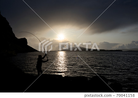 Young man fishing with feathers for mackerel Color 70041158