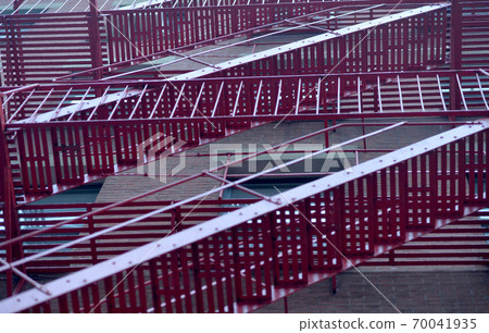Red fire stairs near building in NYC Red fire stairs near building in NYC 70041935