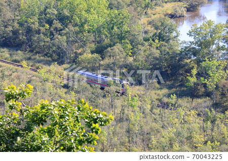 Diesel train on the Kushiro Main Line running in the Kushiro Marsh 70043225