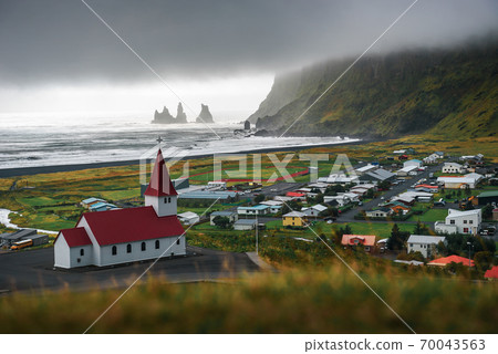 Heavy clouds over the village of Vik i Myrdal in Iceland Heavy clouds over the village of Vik i Myrdal in Iceland 70043563