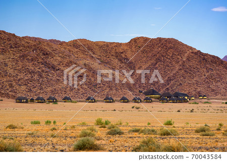 Small cabins of a desert lodge near Sossusvlei in Namibia Small cabins of a desert lodge near Sossusvlei in Namibia 70043584