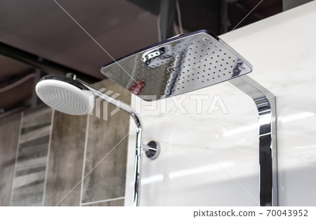 Selling stylish and modern head showers with a water nozzle. Sale of new plumbing, close-up, background, industry 70043952