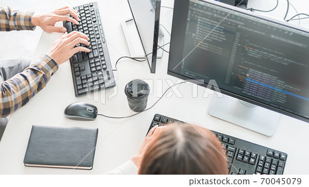 Programmer working in a software development and coding technologies. Website design.Technology concept. Programmer working in a software development and coding technologies. Website design.Technology concept. 70045079
