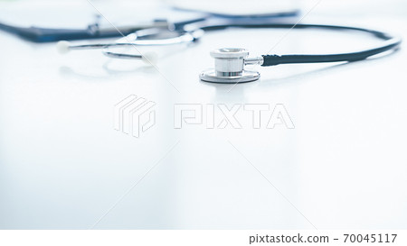 Stethoscope with clipboard and Laptop on desk, Doctor working in hospital writing a prescription, Healthcare and medical concept, test results in background, vintage color. Stethoscope with clipboard and Laptop on desk, Doctor working in hospital writing a prescription, Healthcare and medical concept, test results in background, vintage color. 70045117