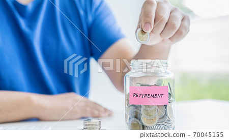 Saving money concept. Close-up of business people hand out coin to stack of coins. Saving money concept. Close-up of business people hand out coin to stack of coins. 70045155