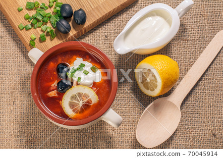 Soup saltwort with meat, potatoes, tomatoes, lemon and black olives 70045914