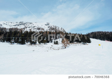 Winter landscape with mountain slopes covered with snow. Winter landscape with mountain slopes covered with snow. 70046368
