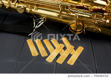 Set of reeds to place in the mouth piece of a saxophone Set of reeds to place in the mouth piece of a saxophone 70046450