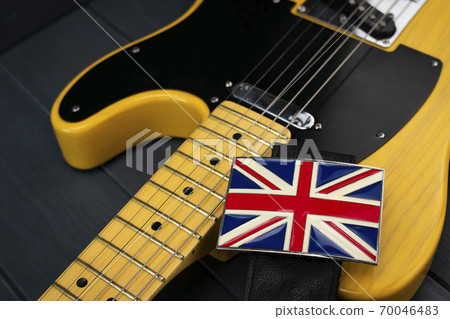 Classic American electric guitar neck with a Union Jack British flag clasp on the strap 70046483