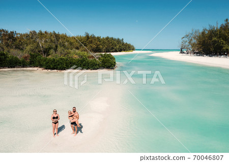 Young beautiful family with a child on a tropical vacation.mauritius island Young beautiful family with a child on a tropical vacation.mauritius island 70046807