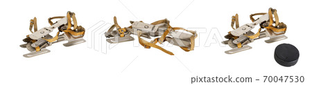 Set of old steel skates isolated on a white background Hockey puck Set of old steel skates isolated on a white background Hockey puck 70047530