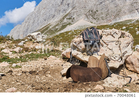 saddler's temporary workplace outdoor in the mountains while grazing livestock in highlang pastures in the Caucasus, Russia 70048061