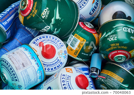 empty gas cylinders from tourist burners and stoves are thrown into a separate garbage container 70048063