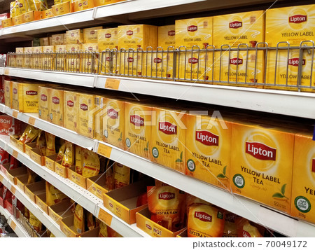 JASIN, MALAYSIA -JUNE 8, 2020: Selected focused on tea powder is sold in commercial packages and displayed on supermarket shelves for sale. Organized by the brand to facilitate customers. 70049172