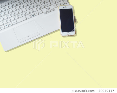 Laptops and mobile phones / smartphones on a yellow background 70049447